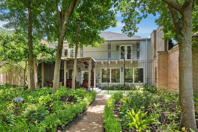 7 Woodstone St, Houston, TX 77024 - back of property with a balcony and french doors