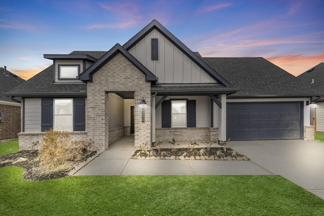 5302 Allen Cay, Texas City, TX 77590 - view of front of property with brick siding, a garage, board and batten siding, a shingled roof, and concrete driveway