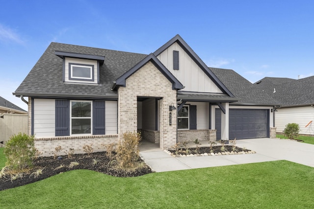5302 Allen Cay, Texas City, TX 77590 - view of front facade with brick siding, a front lawn, a shingled roof, an attached garage, and board and batten siding