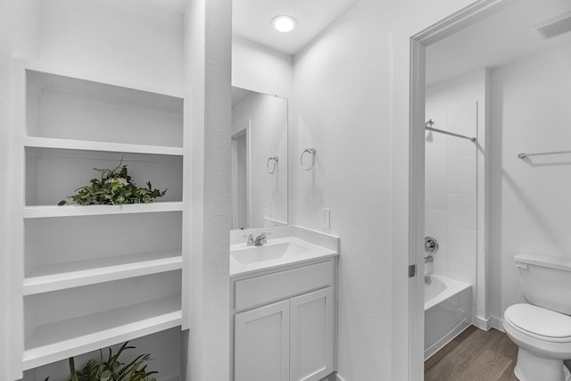 5302 Allen Cay, Texas City, TX 77590 - full bathroom featuring toilet, shower / bathtub combination, vanity, wood finished floors, and baseboards