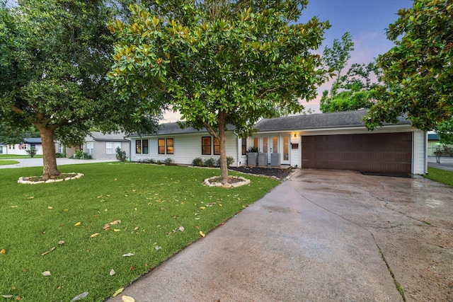 4509 Randwick Dr, Houston, TX 77092 - ranch-style home with driveway, a garage, and a lawn