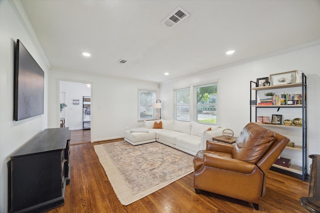 4509 Randwick Dr, Houston, TX 77092 - living area featuring ornamental molding, dark wood-style flooring, and recessed lighting