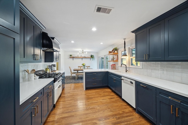 4509 Randwick Dr, Houston, TX 77092 - kitchen with dishwasher, range with gas cooktop, a sink, decorative backsplash, and light countertops