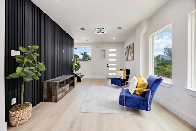 2114 Des Chaumes St, Houston, TX 77026 - sitting room with wood finished floors, baseboards, and recessed lighting