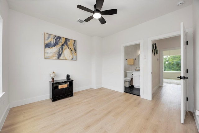 2114 Des Chaumes St, Houston, TX 77026 - spare room featuring ceiling fan, light wood-style flooring, a smoke detector, and baseboards