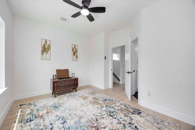 2114 Des Chaumes St, Houston, TX 77026 - bedroom featuring light wood-type flooring, baseboards, and ceiling fan