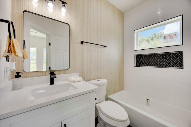 2114 Des Chaumes St, Houston, TX 77026 - full bath featuring toilet, vanity, and bathing tub / shower combination