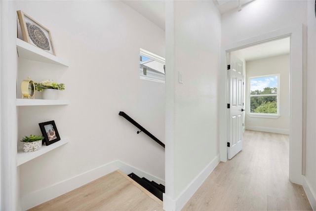 2114 Des Chaumes St, Houston, TX 77026 - stairway featuring wood finished floors and baseboards