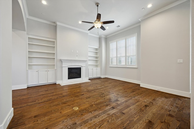 5644 Larkin St, Houston, TX 77007 - unfurnished living room featuring crown molding, a ceiling fan, dark wood-style floors, a glass covered fireplace, and baseboards