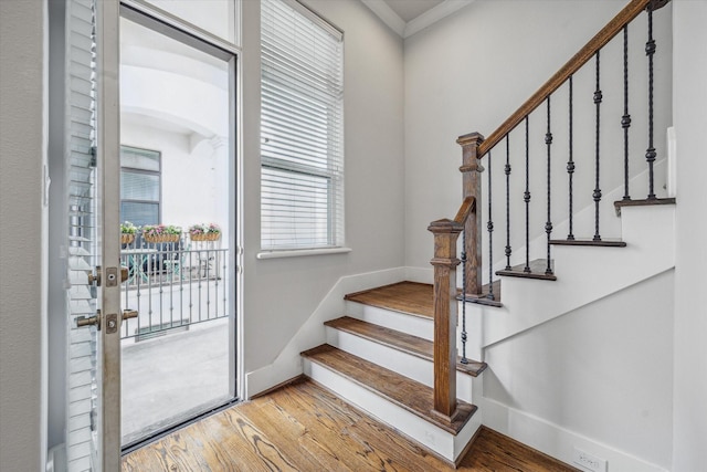 5644 Larkin St, Houston, TX 77007 - stairway featuring wood finished floors, baseboards, and crown molding