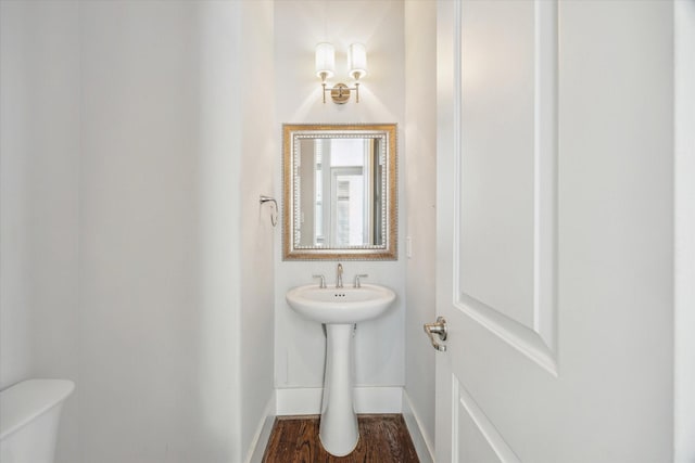 5644 Larkin St, Houston, TX 77007 - half bath featuring baseboards, toilet, and wood finished floors