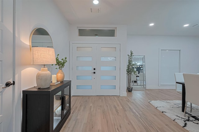 4434 Sarong Dr, Houston, TX 77096 - foyer entrance with light wood-style floors, recessed lighting, and baseboards