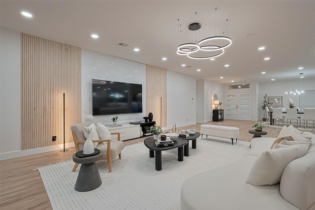 4434 Sarong Dr, Houston, TX 77096 - living area featuring a chandelier, light wood-style flooring, recessed lighting, and baseboards