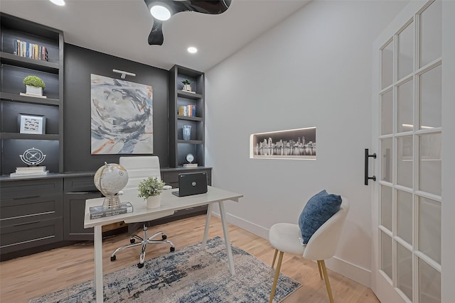 4434 Sarong Dr, Houston, TX 77096 - office featuring light wood finished floors, baseboards, a ceiling fan, and built in features