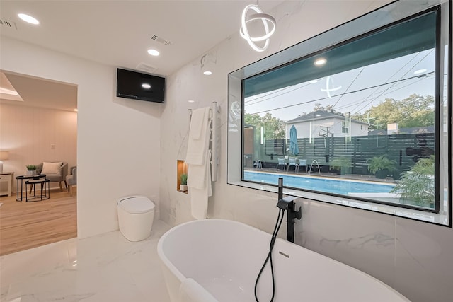4434 Sarong Dr, Houston, TX 77096 - full bathroom featuring a soaking tub, recessed lighting, and marble finish floors