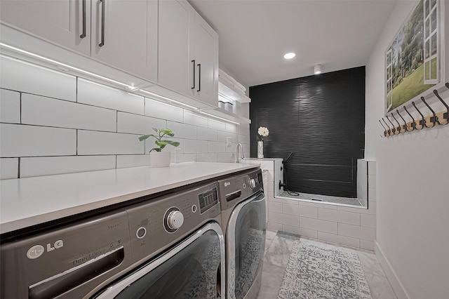 4434 Sarong Dr, Houston, TX 77096 - washroom with washing machine and clothes dryer, light marble finish flooring, recessed lighting, and baseboards