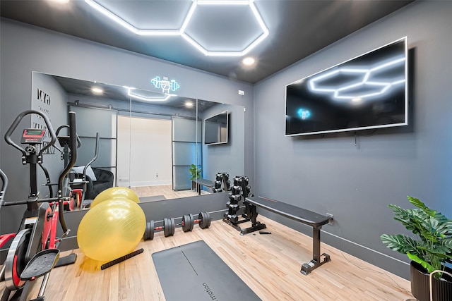 4434 Sarong Dr, Houston, TX 77096 - workout room featuring wood finished floors and baseboards