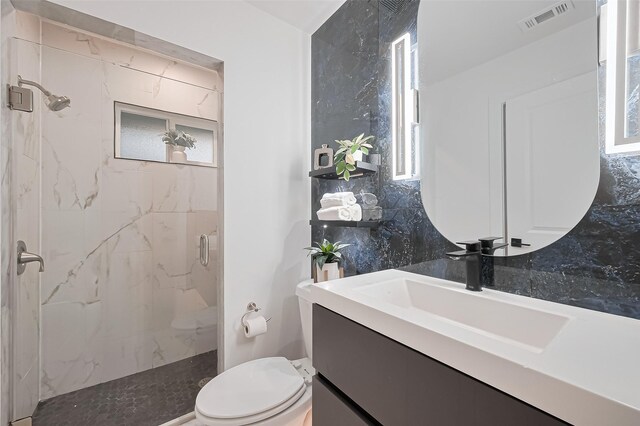 4434 Sarong Dr, Houston, TX 77096 - bathroom featuring a marble finish shower, vanity, and toilet