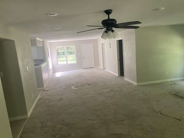 167 County Road 3665 W, Splendora, TX 77372 - unfurnished living room featuring baseboards and ceiling fan