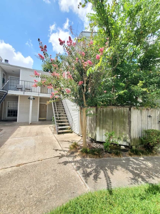 9809 Richmond Ave Unit F14, Houston, TX 77042 - view of front of home featuring stairs and driveway