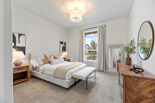 7851 Longhorn Trl, Fulshear, TX 77406 - bedroom with light colored carpet and a chandelier