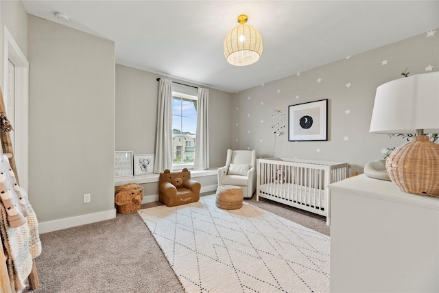 7851 Longhorn Trl, Fulshear, TX 77406 - carpeted bedroom featuring a crib and baseboards
