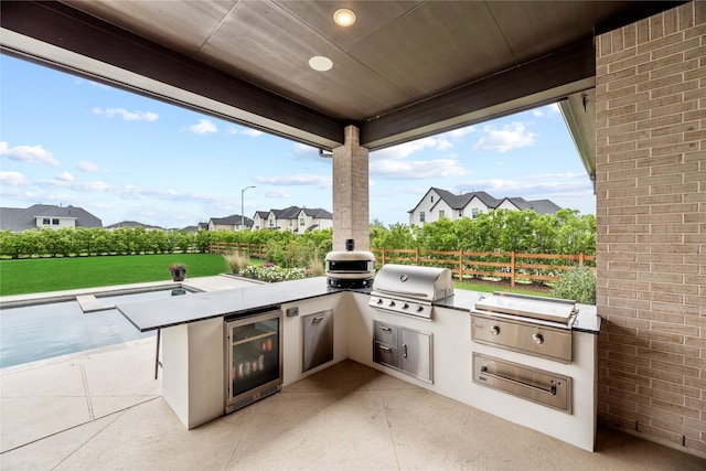 7851 Longhorn Trl, Fulshear, TX 77406 - view of patio / terrace with wine cooler and a residential view