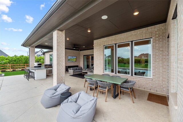 7851 Longhorn Trl, Fulshear, TX 77406 - view of patio featuring an outdoor living space, a ceiling fan, and outdoor dining space