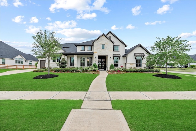 7851 Longhorn Trl, Fulshear, TX 77406 - view of front of home featuring stone siding, french doors, and stucco siding