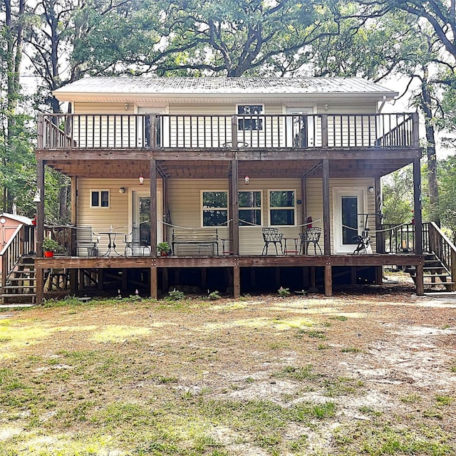 5002 Fm 811, Centerville, TX 75833 - back of property featuring a deck and metal roof