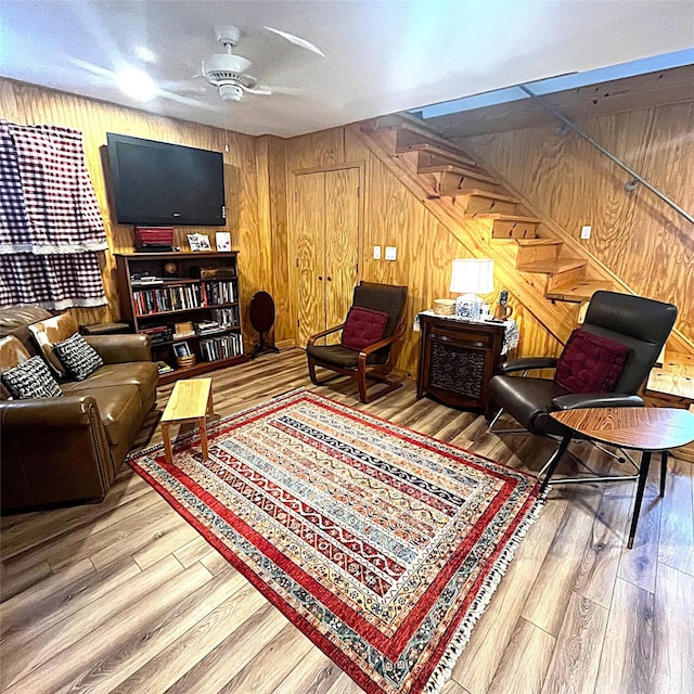5002 Fm 811, Centerville, TX 75833 - living area with ceiling fan, wood walls, stairs, and wood finished floors
