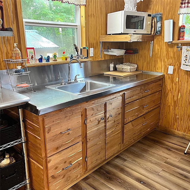 5002 Fm 811, Centerville, TX 75833 - kitchen with stainless steel counters, white microwave, brown cabinets, a sink, and dark wood-style flooring