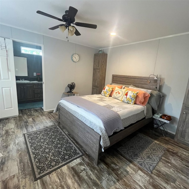 5002 Fm 811, Centerville, TX 75833 - bedroom featuring wood finished floors, crown molding, connected bathroom, a ceiling fan, and a sink