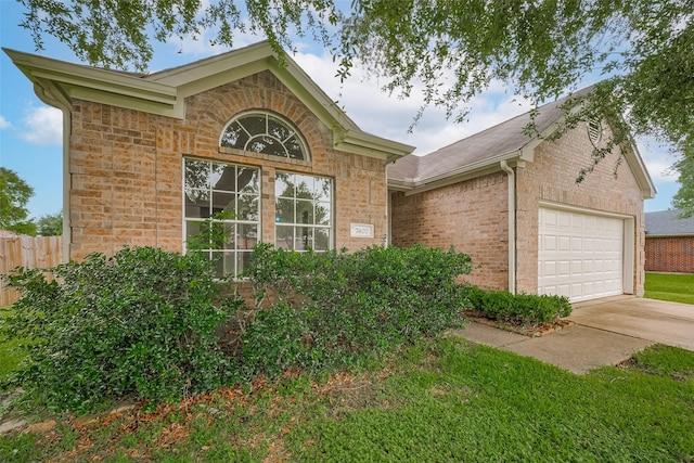 7407 Breda Dr, Baytown, TX 77521 - single story home featuring brick siding, concrete driveway, and a garage