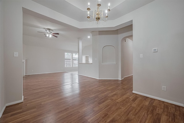7407 Breda Dr, Baytown, TX 77521 - unfurnished room featuring wood finished floors, arched walkways, a ceiling fan, and baseboards