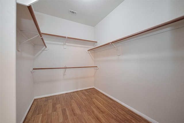 7407 Breda Dr, Baytown, TX 77521 - walk in closet with wood finished floors