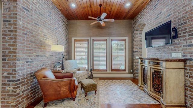7705 Savannah, Beaumont, TX 77707 - sitting room featuring a ceiling fan, wood finished floors, wooden ceiling, brick wall, and recessed lighting