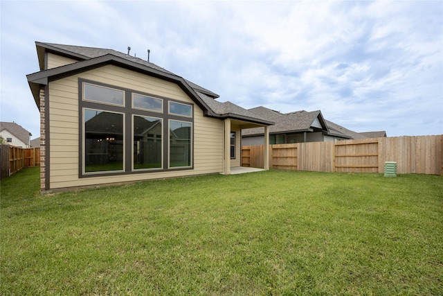 813 Laguna Green Ln, Katy, TX 77493 - rear view of property with a fenced backyard and roof with shingles