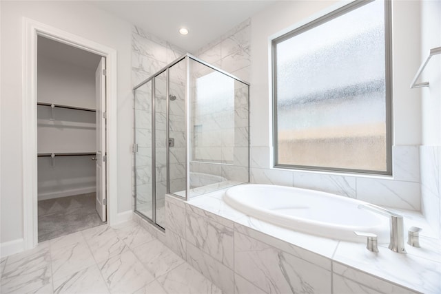 813 Laguna Green Ln, Katy, TX 77493 - full bathroom featuring a marble finish shower, a bath, marble finish flooring, a spacious closet, and recessed lighting