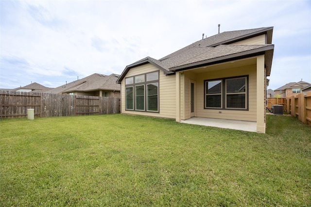 813 Laguna Green Ln, Katy, TX 77493 - back of property featuring a patio, a fenced backyard, and a shingled roof
