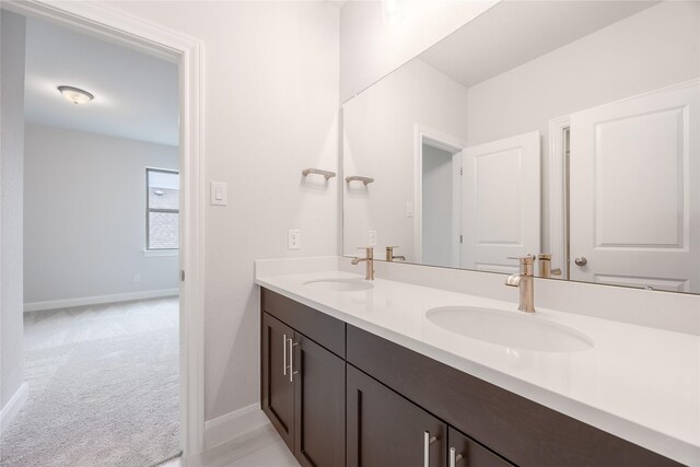 813 Laguna Green Ln, Katy, TX 77493 - full bathroom featuring double vanity and baseboards