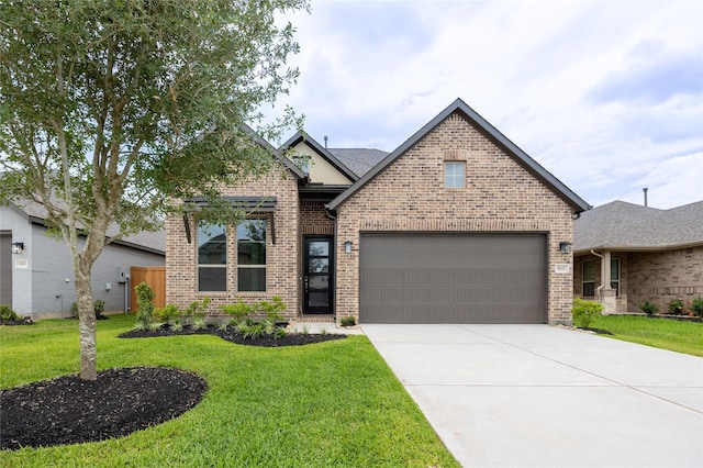 813 Laguna Green Ln, Katy, TX 77493 - view of front of home with brick siding, driveway, and a front yard