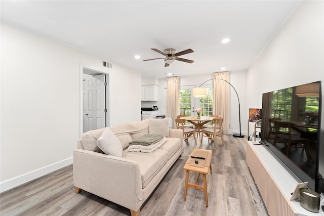 8223 Kingsbrook Rd Unit 212, Houston, TX 77024 - living room with recessed lighting, light wood-style flooring, a ceiling fan, and baseboards