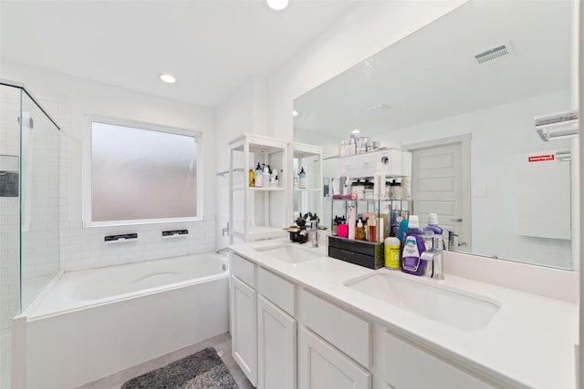 7011 Fleetwood Crescent Way, Richmond, TX 77407 - full bathroom with a garden tub, double vanity, recessed lighting, tiled shower, and tile patterned floors
