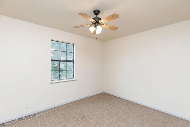 408 S Live Oak St, Mathis, TX 78368 - empty room featuring ceiling fan, baseboards, and light flooring