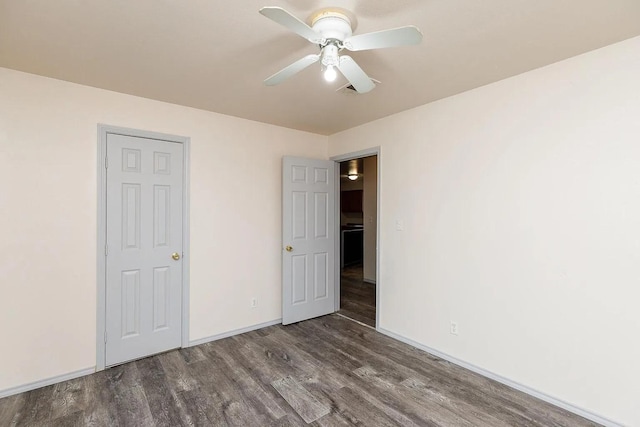408 S Live Oak St, Mathis, TX 78368 - unfurnished bedroom with wood finished floors, baseboards, and a ceiling fan