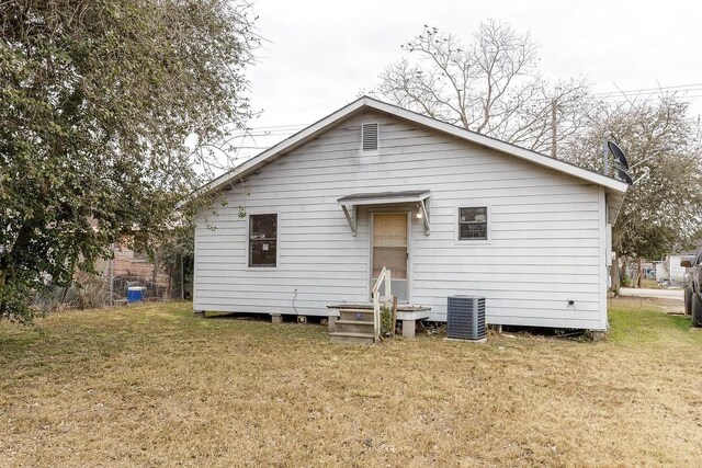 408 S Live Oak St, Mathis, TX 78368 - back of property featuring a yard and cooling unit