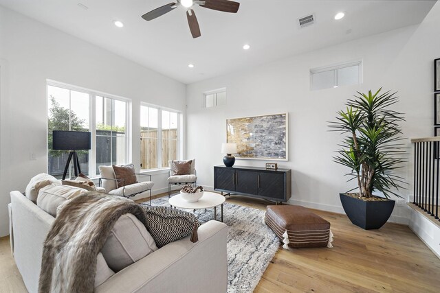 1705 Bologna Ln, Houston, TX 77055 - living area with wood finished floors, ceiling fan, recessed lighting, and baseboards