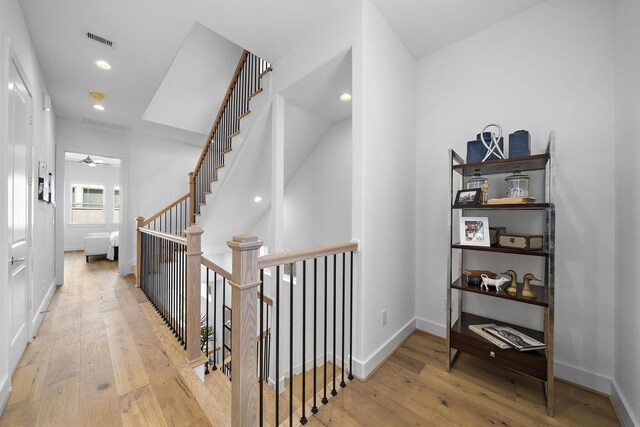 1705 Bologna Ln, Houston, TX 77055 - hall with hardwood / wood-style floors, baseboards, an upstairs landing, and recessed lighting