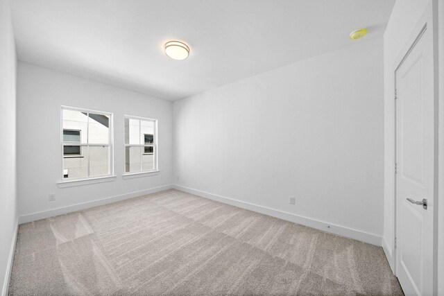 1705 Bologna Ln, Houston, TX 77055 - carpeted spare room featuring baseboards and a smoke detector